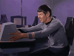 an animation of Spock from Star Trek, gripping a computer in frustration.
